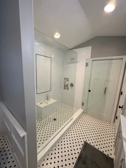 Modern luxury bathroom with freestanding tub and marble finishes