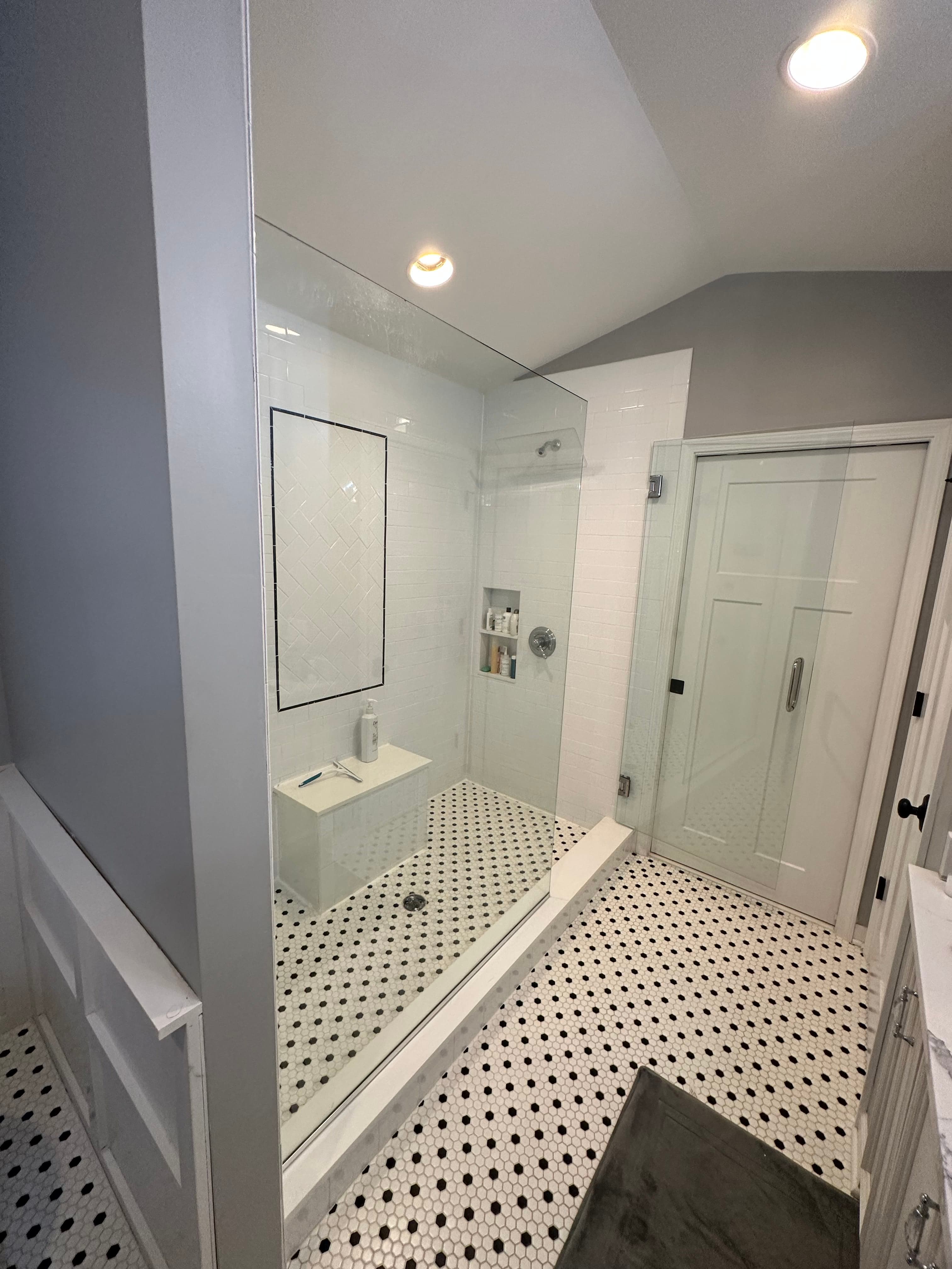 Modern luxury bathroom with freestanding tub and marble finishes