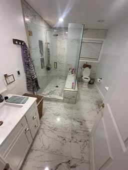 Elegant bathroom with double vanity and custom tile work