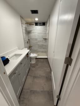 Compact bathroom with smart storage and premium fixtures