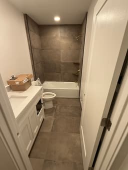 Spa-like bathroom with steam shower and natural stone